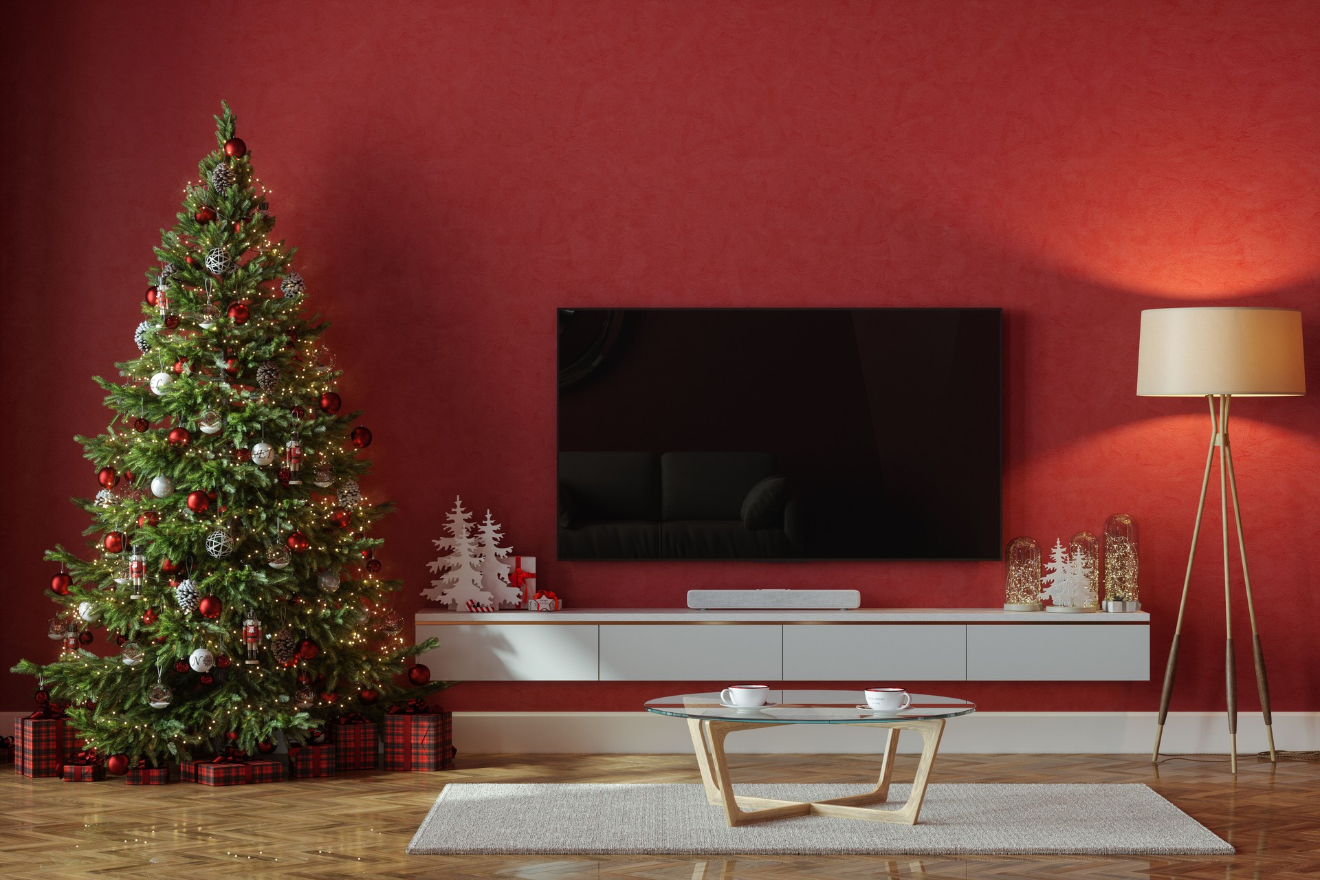 Living Room Interior With Christmas Tree, Ornaments, Gift Boxes, Television Set And Red Wall